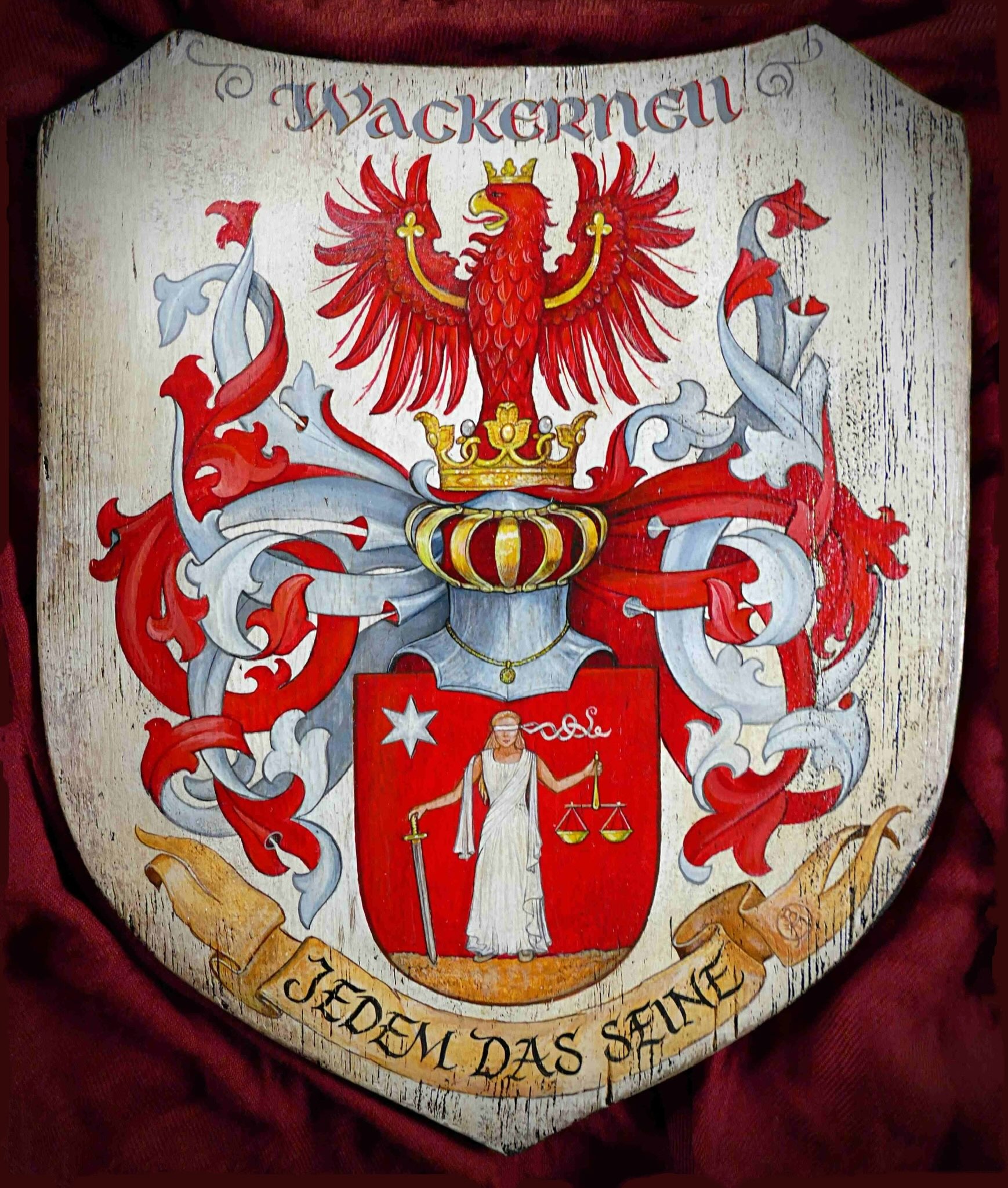 Hand-painted 'Wackernell' family coat of arms with a crowned red eagle crest, a shield depicting Lady Justice, and the motto 'Jedem das Seine'