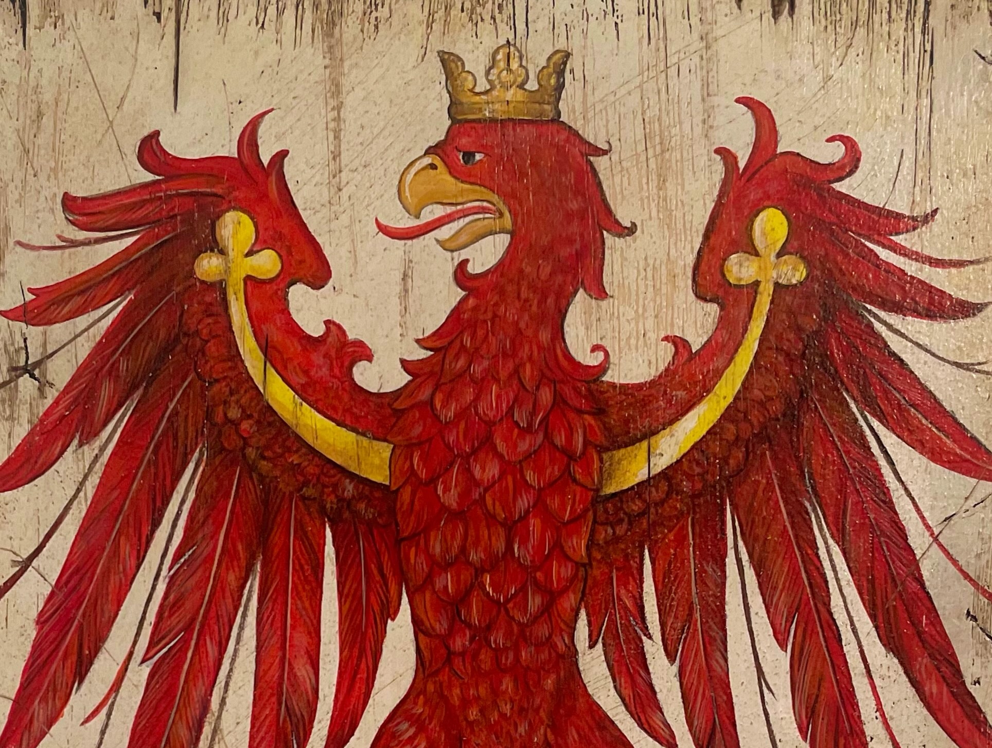 Detail of a hand-painted crowned, double-headed red eagle crest with outspread wings